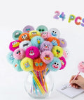 Fluffy Pom Pom Pens 24 Pack Cute Plush Kawaii Novelty Pens for Kids and Adults Soft Face Fun Pens in a glass jar with writing hand.