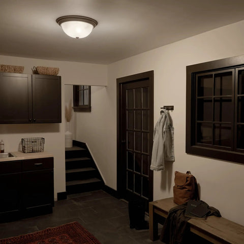 Three Light Flush Mount Ceiling Light in Brushed Nickel With Clear Satin Etched Glass illuminating an entryway.