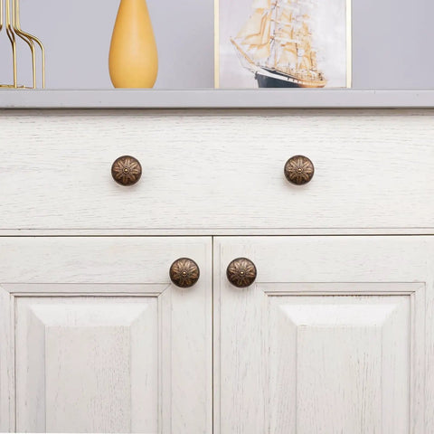 Antique Brass Cabinet Knobs Set Of 4 1.4 Inch Round Vintage Dresser Drawer Handles For Cabinets And Furniture Rustic Flower Shaped Design Durable Zinc Alloy Finish on white dresser