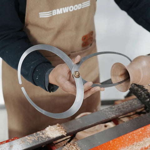 Hella Durable Double Ended Bowl Calipers Stainless Steel Woodworking Measuring Tool For Inner Outer Diameter And Wall Thickness Gauge held while measuring a wooden bowl.