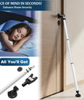 Three In One Door Security Bar With Heavy Duty Metal, Adjustable From Sixteen To Forty One Point Seven Inches, Sliding Patio Door Lock Stick With Two Point Eight Inch Non Slip Base, Portable Home, Apartment And Travel Safety Lock For Doors And Windows positioned against a door