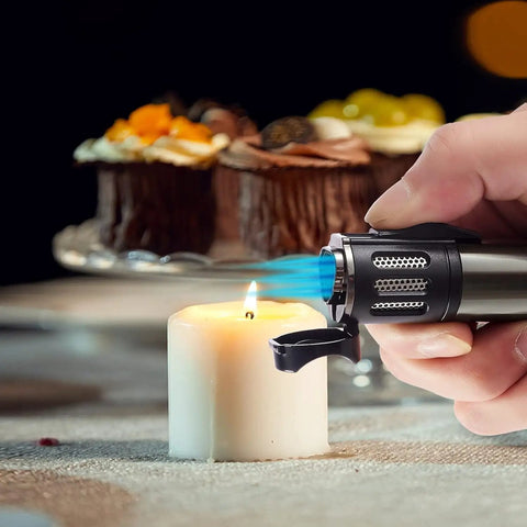 2 Pack Torch Lighters With Triple Jet Flame lighting a candle, showcasing windproof feature and black-nickel design for kitchen use.
