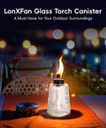 Three Pack Glass Tabletop Torches For Outdoor Vibes With Citronella Oil Fuel Canisters Wicks And Caps on a table at night