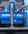 Front view of a compact skid steer loader with crawler tracks and wear resistant bucket for easy operation in urban spaces