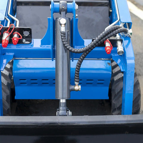 Front view of a compact skid steer loader with crawler tracks and wear resistant bucket for easy operation in urban spaces