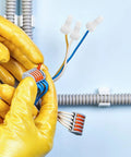 Massive 1000 Piece Kit Of White Closed End Wire Connectors With Easy Crimp Caps For Electrical Wiring And Automotive Repairs To Keep Your Connections Solid. white closed end wire connectors on electrical wires in yellow gloved hand