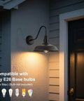 10 Inch Dome Gooseneck Outdoor Wall Light Bronze Exterior Barn Porch Fixture with warm glow at night beside door