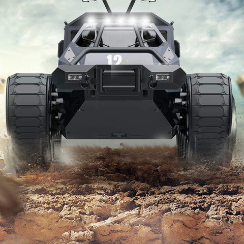 Front view of Remote Control Crawler Tank Off Road 4WD RC Car with thick tires on rugged terrain