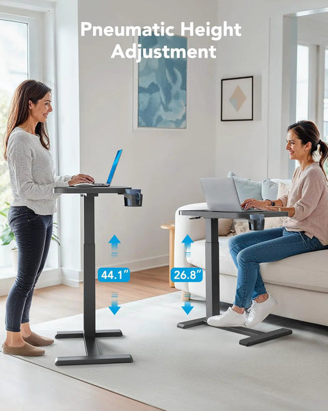 Two women using 32 Inch On Wheels Overbed Desk With Cup Holder And Height Adjustable Pneumatic Lift Rolling Computer Cart in home office.