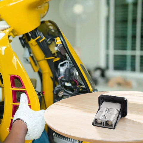High Amperage Electric Vehicle Charging Connector Slick Fixed Base Heavy Duty Coupler mounted on a motorcycle, highlighting solid design.