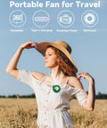 Woman wearing Ultra Quiet Mini Bladeless Portable Neck Fan With Hands Free Clip, 3 Speeds, green fan in wheat field