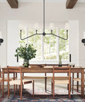 Dining room setting with 47 Inch Four Light Linear Kitchen Island Pendant In Matte Black With White Linen Shades Dope Modern Look