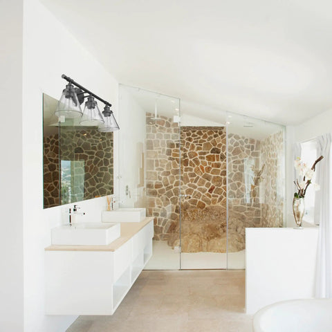 Modern bathroom with stone wall shower and oil rubbed bronze all in one bathroom set with 3 light vanity fixture and coordinating accessories.