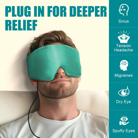 Ultra Soft Heated Eye Mask With Adjustable Warmth For Dry Eyes And Puffy Eyelids Fast Relief For Sinus Pressure And Tension Headaches Hits Different Premium Silk Touch Fits Snug Real Good Restorative Warmth Chill Vibe worn by a man with a plugged in cord.