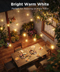 Clear Bulb Outdoor String Lights, 96ft RGBWIC Dimmable Patio And Backyard Lighting With 30 LEDs, 111 Modes, IP67 Waterproof hanging above patio dining