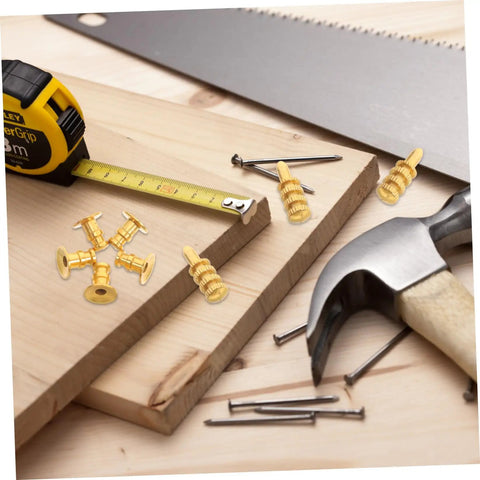 24 Pack Zinc Alloy Dowel Pins arranged on wooden boards with a tape measure and tools for cabinet setup.