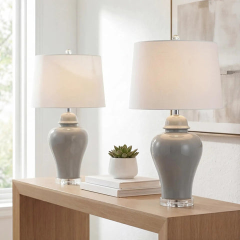 27 Inch Gray Ceramic Urn Table Lamps Set Of 2 With White Linen Shade For Living Room And Bedroom, LED Bulbs Included, Dope Farmhouse Style Bedside Lights, ETL Listed For Safety on a wooden table.