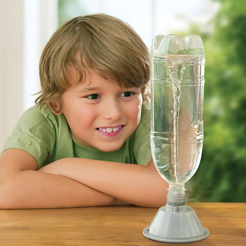 Child observing KidzLabs Tornado Maker Kit For Kids on table, plastic bottle with vortex demonstration, STEM learning tool