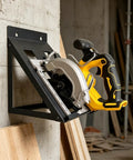 Heavy Duty Power Tool Rack And Storage Hanger for workshop, holding a yellow and black power tool, mounted on a concrete wall.