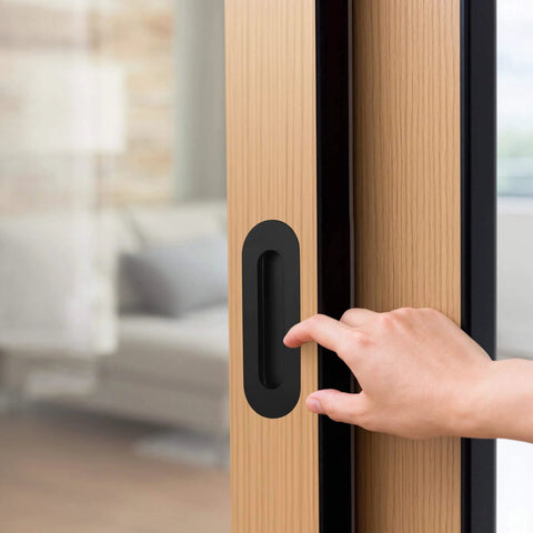 6 Inch Oval Black Pocket Door Pull Heavy Duty Stainless Steel Finger Flush Pull For Closet And Sliding Barn Doors 2 Pack Durable Rust Resistant 304 Stainless Hardware installed on wooden door