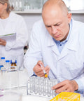 Scientist using Two Piece Acrylic Test Tube Holder Rack With 12 Socket Vial Stand, Clear Lab Organizer in lab setting