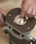 Dead On Accuracy 30mm Router Guide Bush Spigot for jig routing on a router base, showing hands installing the accessory.