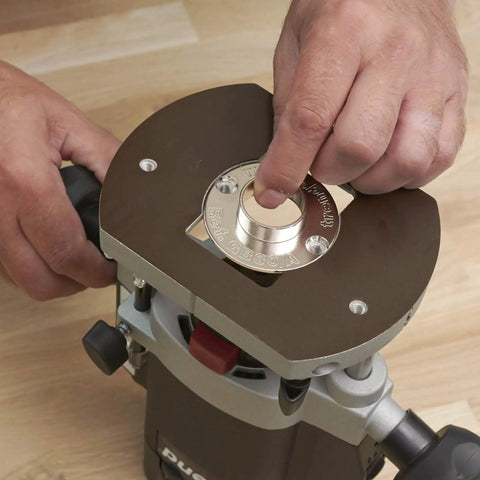 Dead On Accuracy 30mm Router Guide Bush Spigot for jig routing on a router base, showing hands installing the accessory.