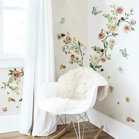 Image of Rose Vine Floral Wall Decals Peel And Stick Watercolor Garden Theme For Bedroom Living Room And TV Wall Easy To Apply No Mess Waterproof Non Toxic Self Adhesive Material shown on a wall in a room with a white chair.