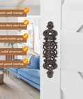 Two Piece Rustic Cast Iron Door Handle Set For Barn Doors Cabinets And Drawers in antique black with decorative design on white wood.