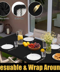 Waterproof Elastic Fitted Table Cloth For 6 Foot Tables Washable Polyester Table Cover For Picnic And Outdoor Use Elastic Edge Keeps It Snug Without Clips Stays Put On Breezy Days Black 30 By 72 Inches on outdoor table with plates and drinks