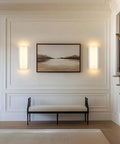 Aipsun Hardwired Wall Sconces Set of Two 28W 3-Level Dimming LED installed on wall with painting and bench.