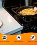 Stove Gap Covers 13.8 To 27.5 Inch Adjustable Black 2 Pack shown between stove and counter in kitchen.