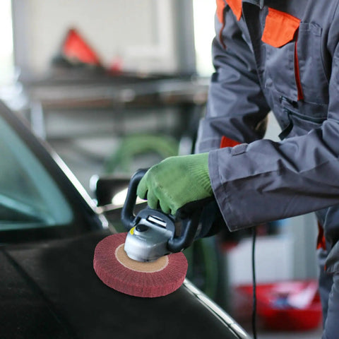 Man using Heavy Duty VOSAREA Bench Grinder Buffing Wheel With Nonwoven Abrasive Cloth on car surface for polishing.