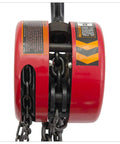 Top Shelf Manual Chain Block Hoist With Double Hook Setup And Precision Load Brakes; close-up of red hoist drum and chain.