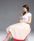 Woman using phone with Organic Cotton EMF Protection Baby Blanket With Silver Shielding 5G Blocking Belly Shield for Pregnancy Moms