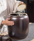 Heavy Weight Rice Storage Box Kitchen Sealed Grain Dispenser Airtight Cereal Jar With Lid being filled with rice.