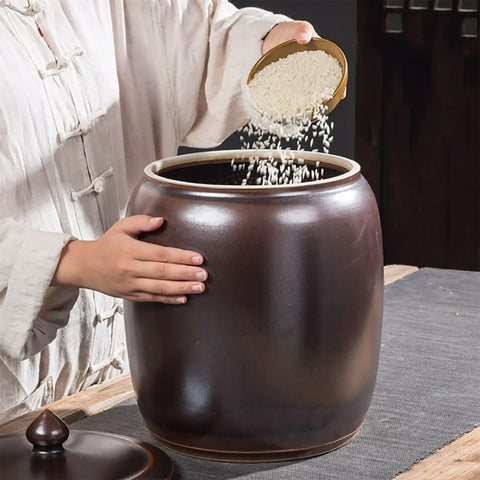 Heavy Weight Rice Storage Box Kitchen Sealed Grain Dispenser Airtight Cereal Jar With Lid being filled with rice.