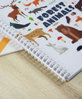 Close-up of bound forest animals book using Coil Binding Machine For 3 To 1 Pitch With 32 Hole Punch, suitable for spiral spines.