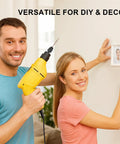 A man holding a yellow electric drill with a 4 Piece Drill Chuck Adapter Set 1/4 Inch Hex Quick Change, woman hanging a photo frame.