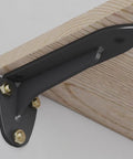 Heavy Duty Wall Mounted Shelf Brackets 2 Pack Black Iron Metal L Shape Floating Supports For Diy Open Shelving Includes Hardware, close-up view of bracket with wood.