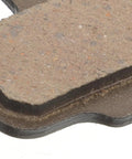 Close-up of lightweight semi-metallic mountain bike disc brake pad, part of 4 pairs replacement kit for hydraulic systems.