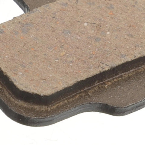 Close-up of lightweight semi-metallic mountain bike disc brake pad, part of 4 pairs replacement kit for hydraulic systems.