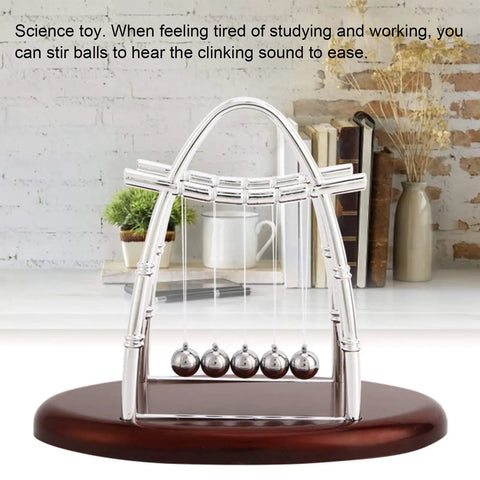 Newton Cradle Desk Toy With Clinking Pendulum Balls Calming Stress Relief For Home Office Decor Educational Gift For Students And Kids Ideal Desk Accessory For Focus, Breaks, And Chill Mindful Learning on a wooden base