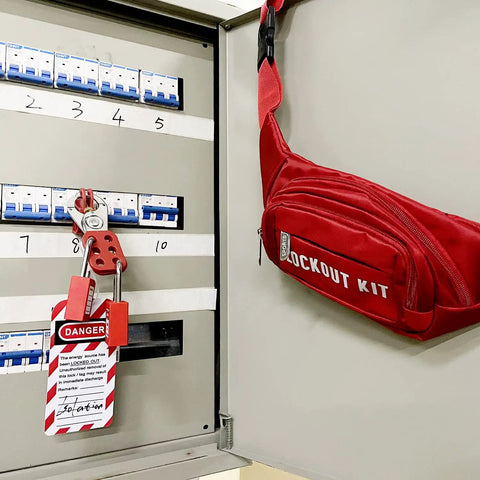 Lockout Tagout Kit For Electrical Safety With Group Hasps, Lockout Tags, 2 Keyed Different Padlocks, Pocket Nylon Bag And Durable Ties For OSHA Compliant No Nonsense Safety Lockout, Maintenance, And Power Shutdowns beside electrical panel.