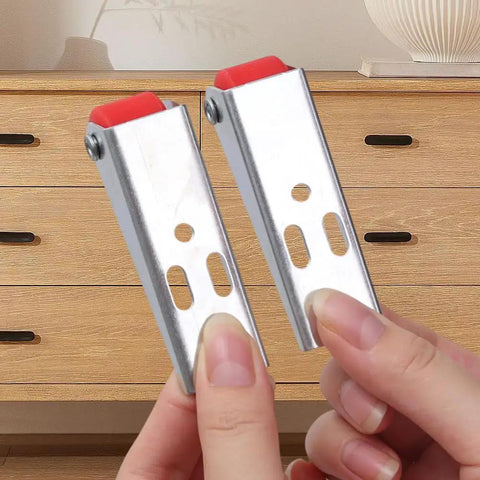Top Shelf Set Of Four Stainless Steel Cabinet Door Rollers Paired With Heavy Duty Galvanized Track And Durable Plastic Gliders For Smooth As Butter Bottom Casters held in hands.