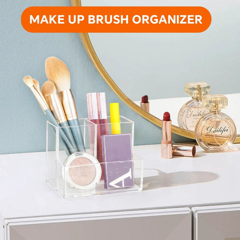 Clear Acrylic Desk Pen Holder With Three Independent Compartments, ideal for organizing makeup brushes on a vanity.