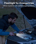 Man using Beast Bright 10000 Lumen Flashlight Rechargeable 30W USB-C Handheld LED Light for car repair at night outdoors