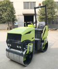 Heavy Duty 800kg Hydraulic Double Drum Vibratory Road Roller Crushes Pavement Repair Jobs With Rock Solid Asphalt Surface Leveling Gear, green and black exterior.
