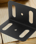 Beefy Heavy Duty L Shape Iron Corner Bracket Set 4 Pieces Right Angle Shelf Braces on wooden surface close-up