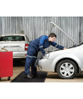Mechanic using Air Step Anti Fatigue Floor Mat Black 36 Inch Long 24 Inch Wide With Three Eighths Inch Vinyl Foam Cushioned Support